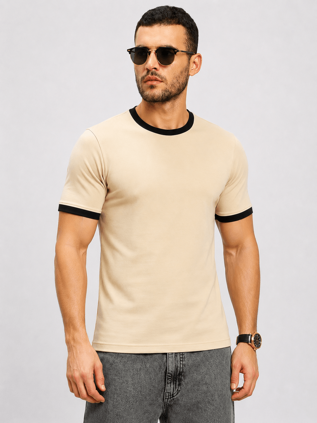 MINIMALIST CONTRAST EDGE T-SHIRT BEIGE modeled by a man wearing sunglasses and casual jeans.