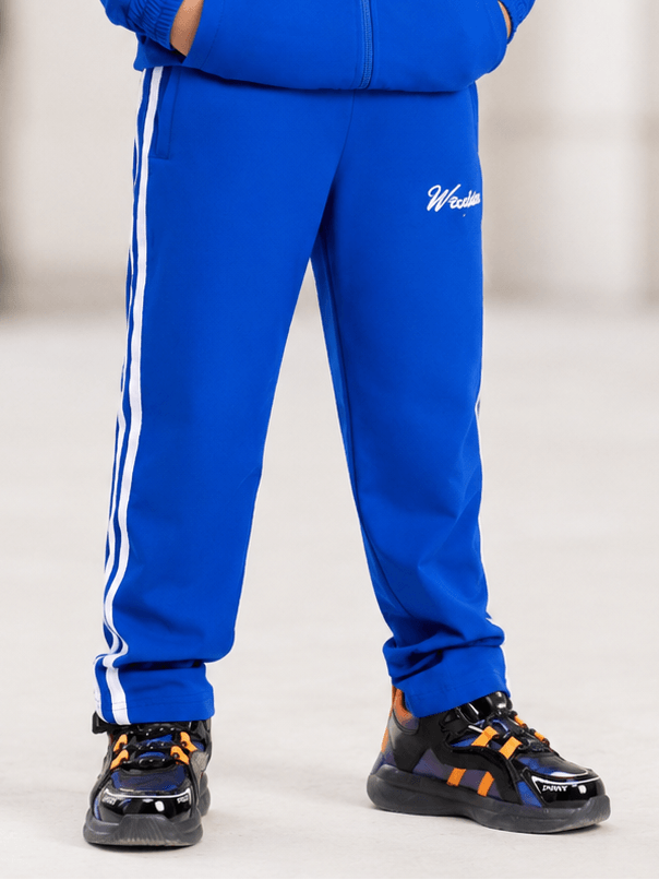 SPORTY STRIPE JOGGER FOR BOYS AND GIRLS ROYAL BLUE with stylish stripe detailing and sporty sneakers.