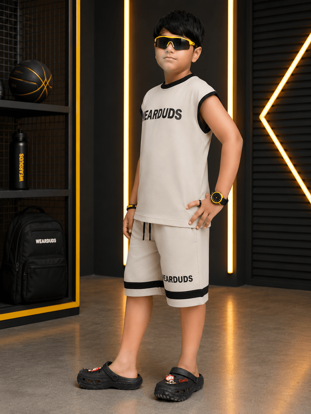 MONO EDGE SLEEVELESS CO-ORD FOR BOYS GIRLS BEIGE worn by a confident boy in a stylish, modern outfit.