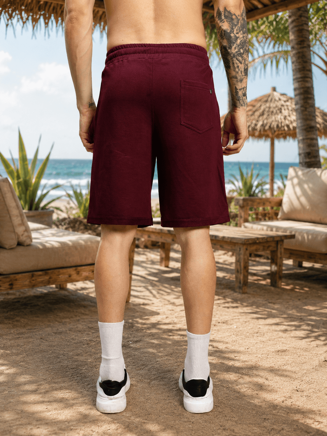 DRIVE MONOCHROME RELAXED FIT SHORTS MAROON shown from the back, perfect for casual beachwear and relaxed outings.