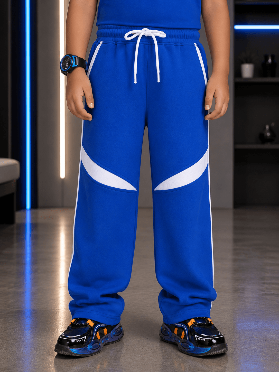 KIDS ROSTER JOGGER FOR BOYS GIRLS BLUE showcased on child, featuring a stylish design and vibrant blue color.