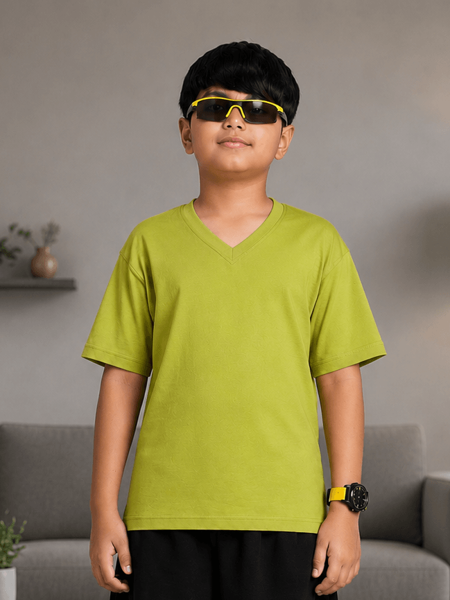 COOLFIT T-SHIRT FOR BOYS GIRLS LIME GREEN worn by a boy with sunglasses, perfect for vibrant streetwear style.