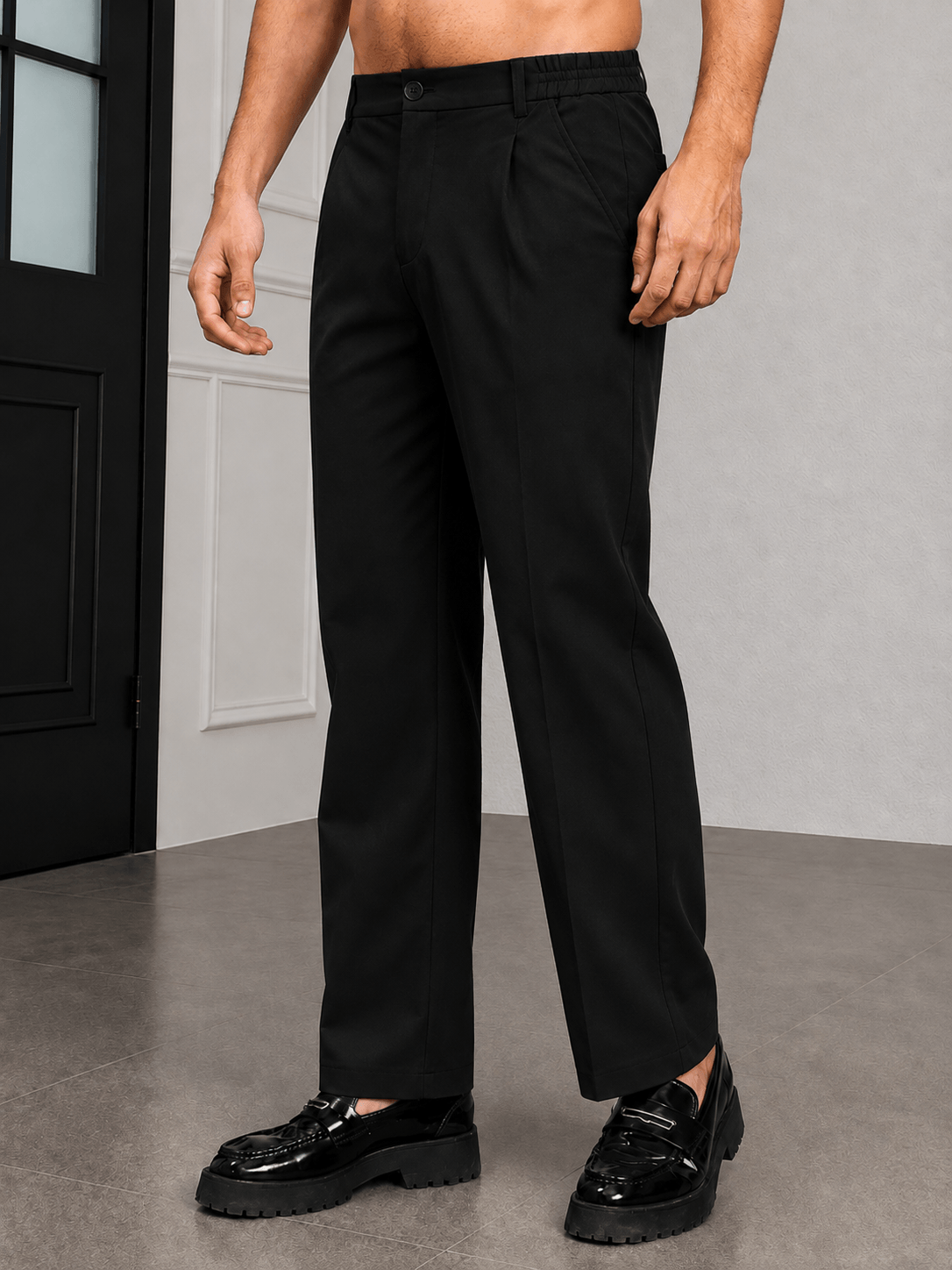 HIGH-FLEX TAILORED PANTS DARK BLACK worn by a model, showcasing a sleek design and modern comfort.