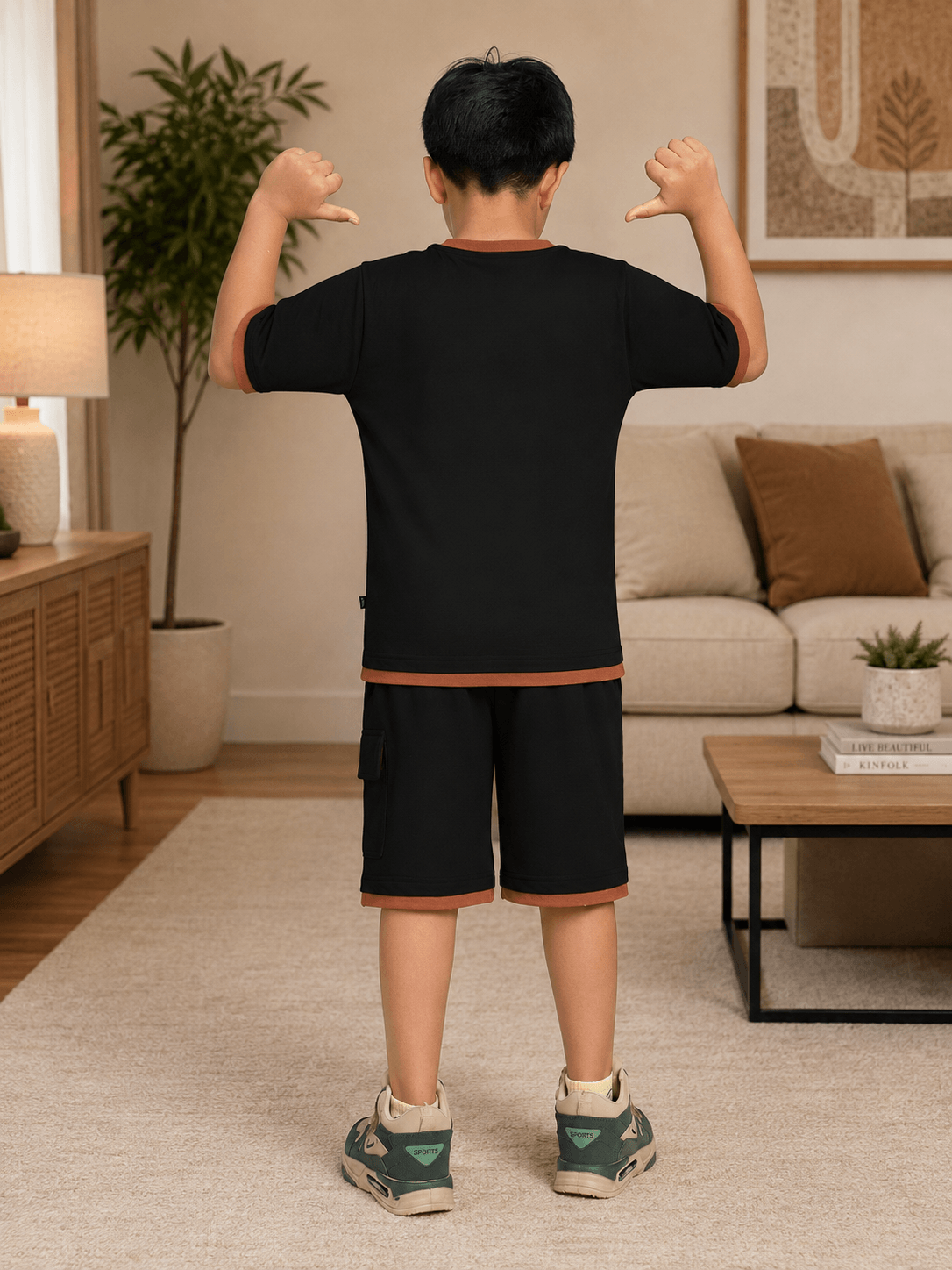 SPEED CLUB SET CO-ORD FOR BOYS GIRLS BLACK worn by a child, showcasing the back view in a stylish living room setting.