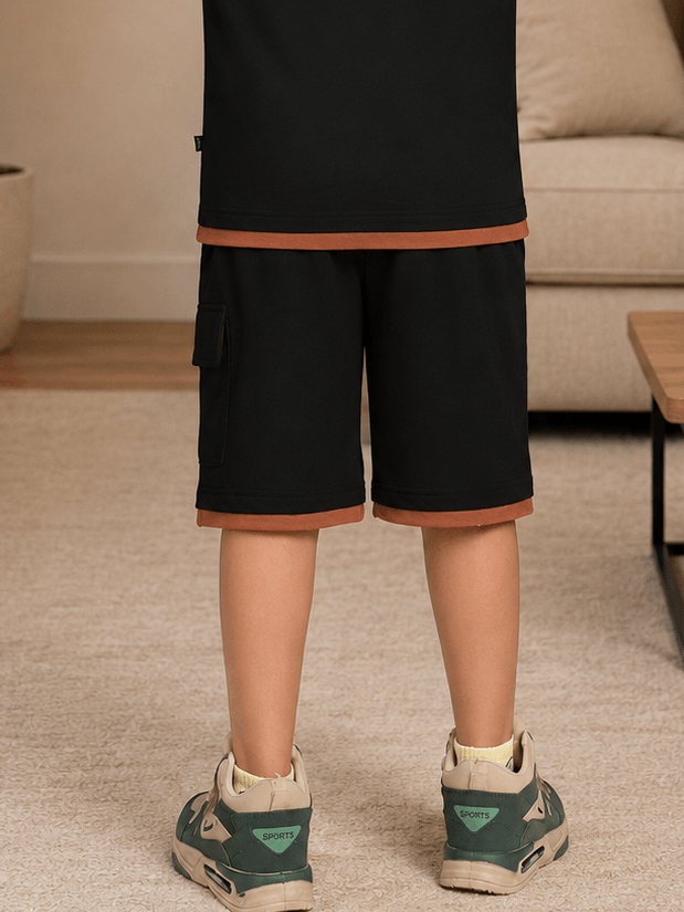 SPEED CLUB SET SHORTS FOR BOYS GIRLS BLACK worn by a child, showcasing sporty design and casual style.