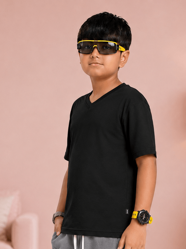COOLFIT T-SHIRT FOR BOYS GIRLS BLACK worn by a boy in stylish sunglasses, showcasing modern streetwear fashion.