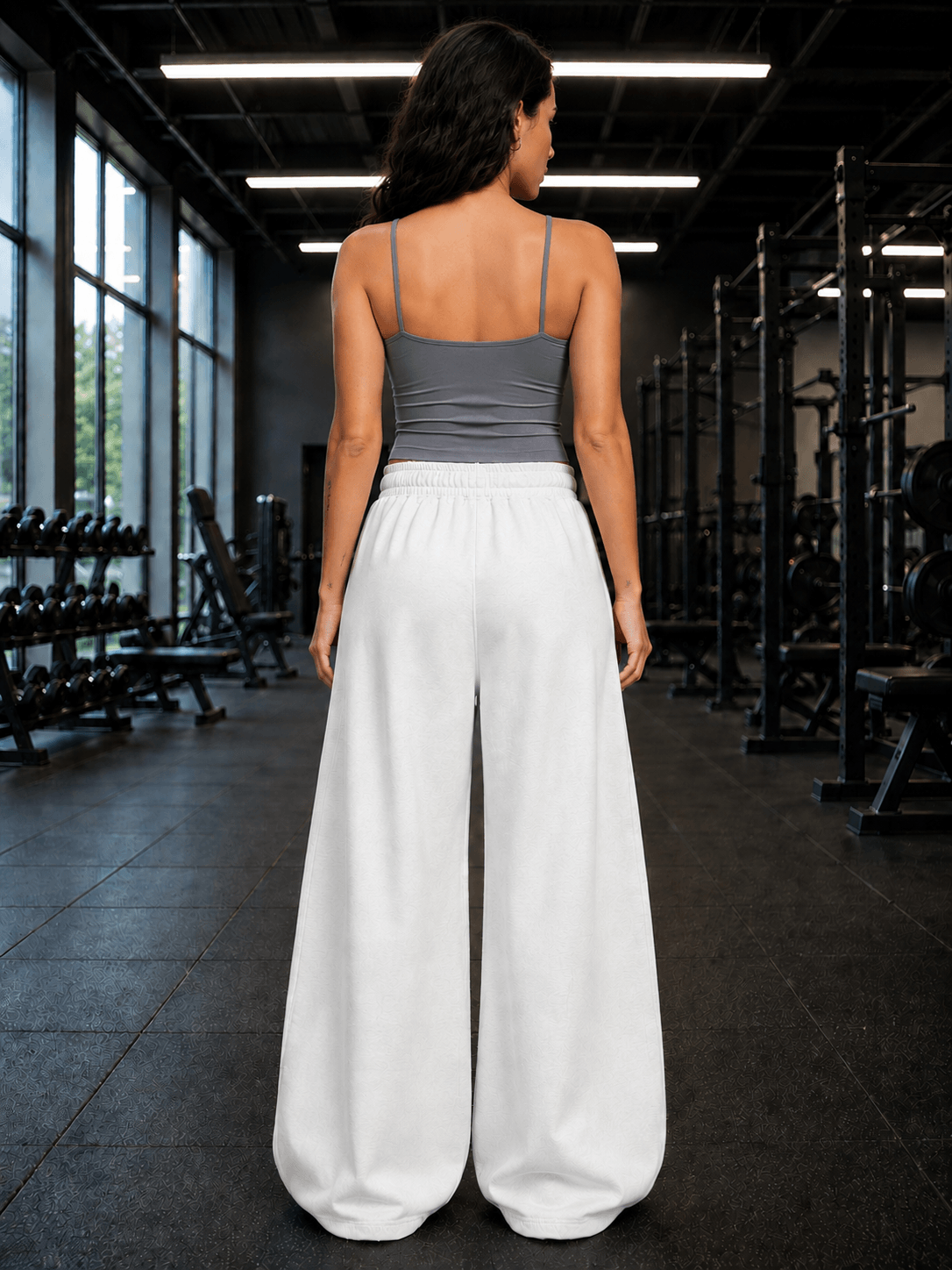 Women Seamless Cotton Crop-Top Grey worn with white loose-fitting pants in a gym setting.