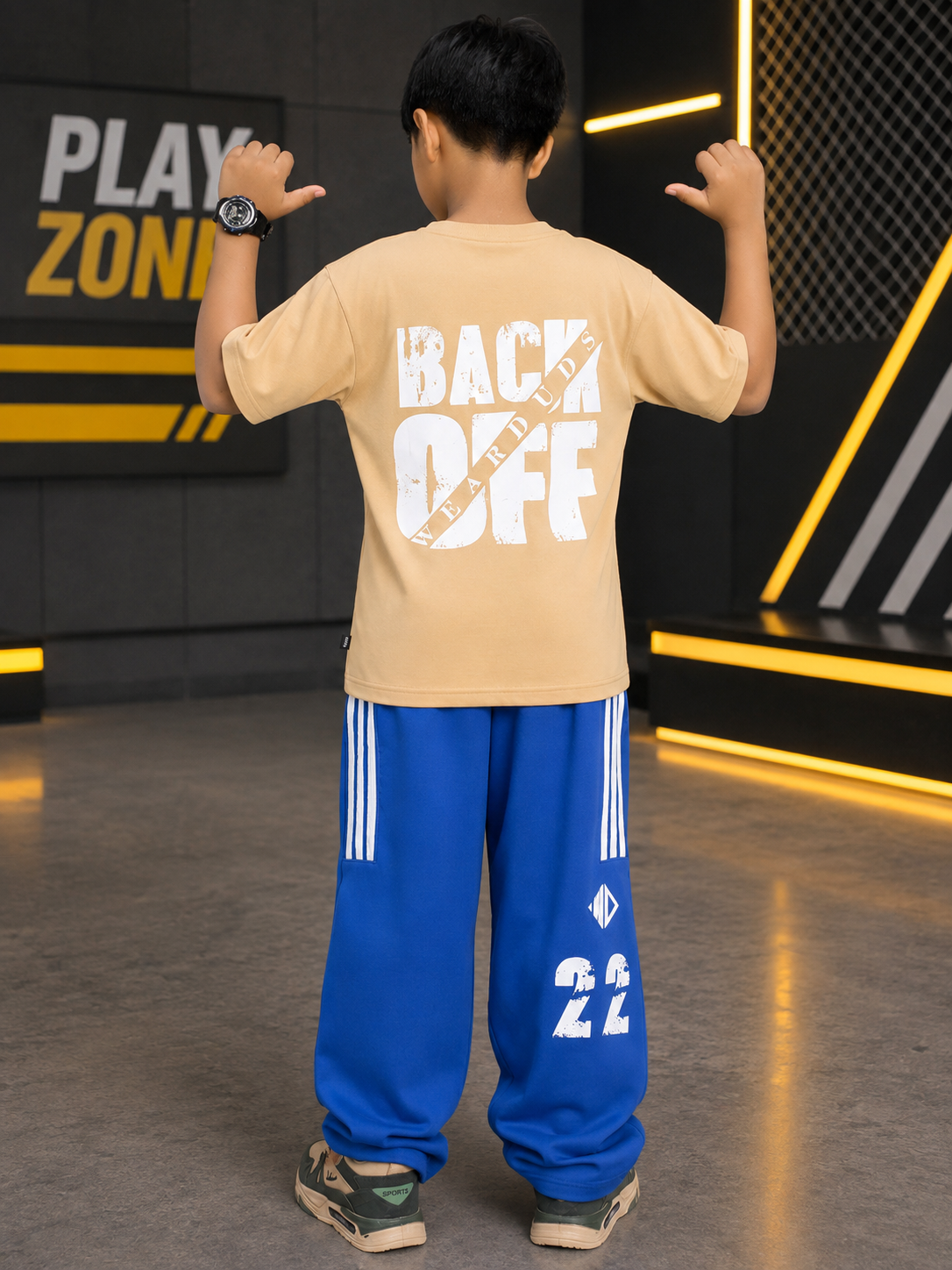NEO STREET DROP CO-ORD FOR BOYS GIRLS BEIGE BLUE worn by a boy with BACK OFF print, featuring blue pants and beige t-shirt.