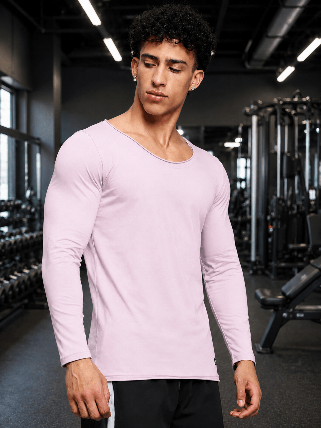JOEL SLIM FIT COTTON SWEATSHIRT LILAC worn by a man in a gym setting, showcasing its sleek and modern design.