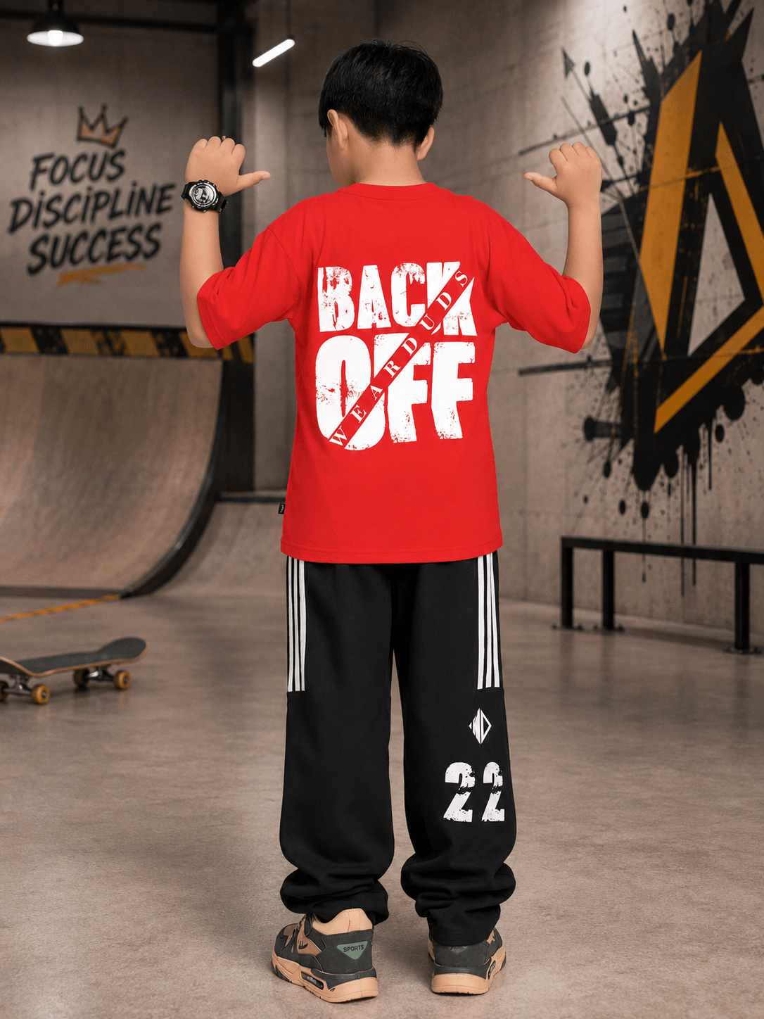 NEO STREET DROP JOGGER FOR BOYS GIRLS BLACK worn by a child showing a back view in a skate park setting.