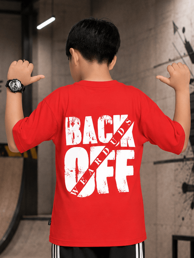 NEO STREET DROP T-SHIRT FOR BOYS GIRLS RED worn by a child showcasing a bold graphic design on the back in a casual setting.