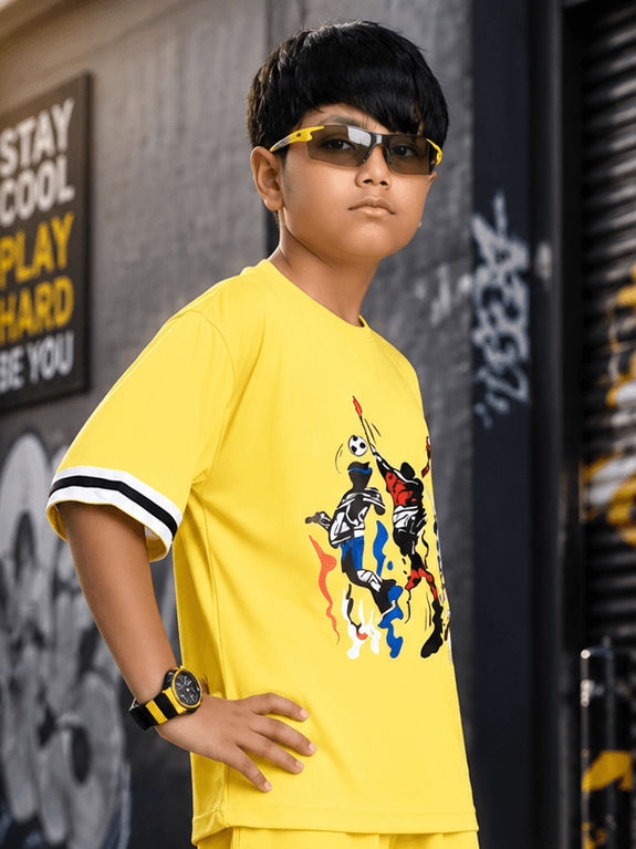 THE STREET T-SHIRT FOR BOYS GIRLS YELLOW worn by a boy, showcasing vibrant design and stylish look.