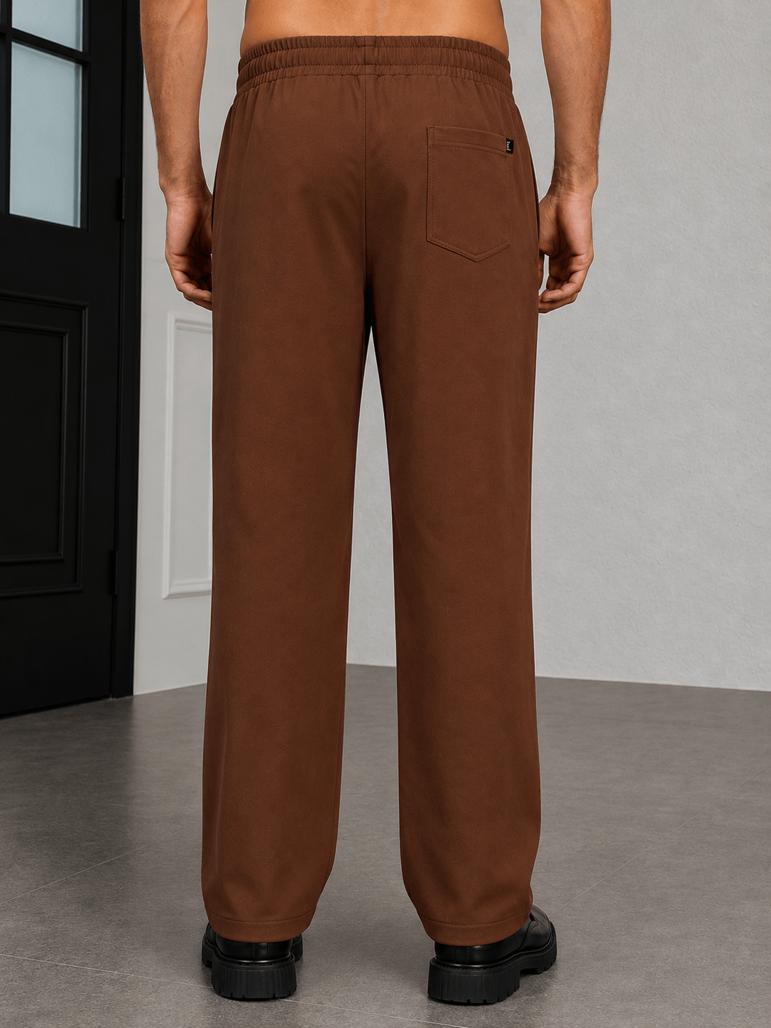 ATHLETIC DRESS TRACK TROUSERS BROWN back view showcasing comfort and stylish design in warm brown color.