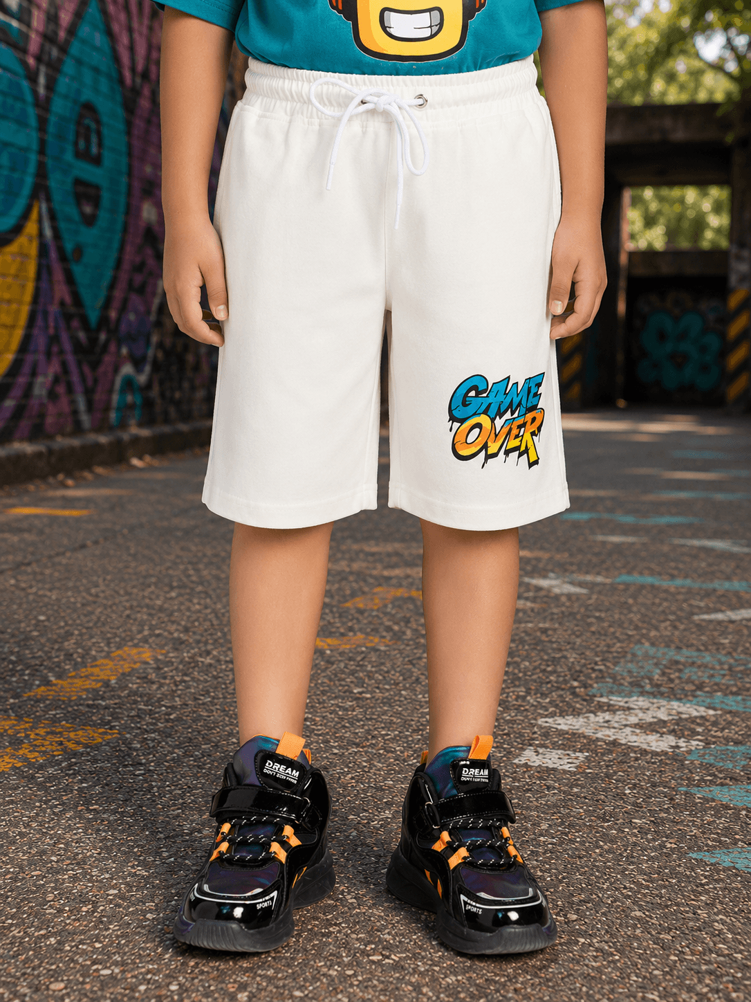 JUNIOR SHORTS FOR BOYS GIRLS WHITE worn by a child, featuring a sporty design and comfortable fit for active play.