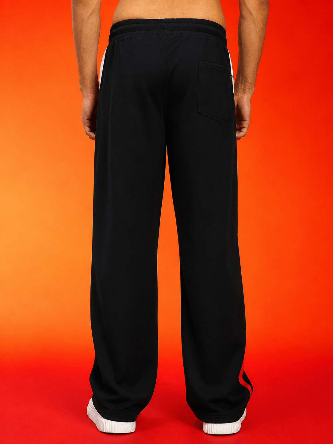 Back view of METROPOLITAN CONTRAST GRAPHIC JOGGERS BLACK MULTI showcasing stylish relaxed fit and sleek design.