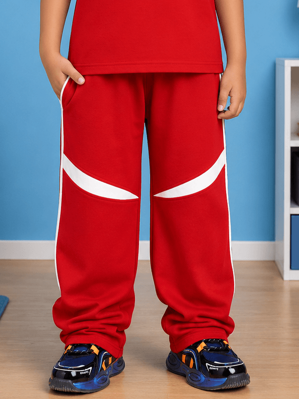 KIDS ROSTER JOGGER FOR BOYS GIRLS RED WHITE showcasing vibrant red and white sporty design on a child.