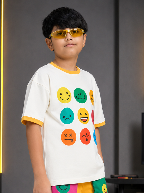 Boy wearing EMOJI VIBES T-SHIRT FOR BOYS GIRL WHITE with colorful emojis and sunglasses, stylish and fun.