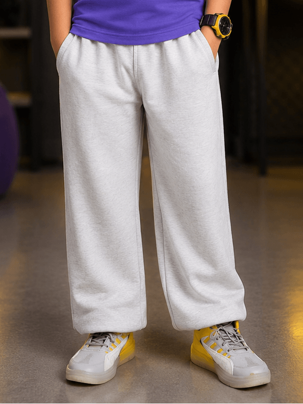 COOLFIT JOGGER FOR BOYS GIRLS WHITE featuring a young model wearing comfortable joggers with a casual stylish look.