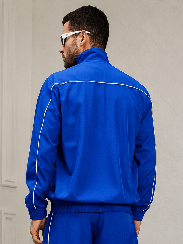 RAIDER POLYESTER FULL ZIPPER JACKET BLUE showcased in vibrant blue from the back with sporty details.