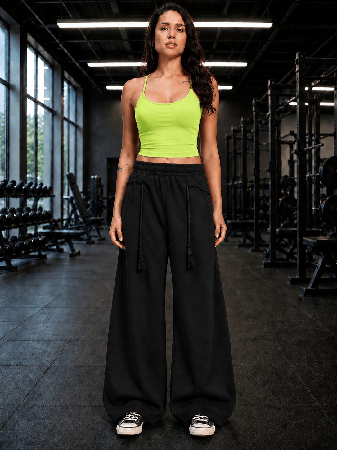 Women Seamless Cotton Crop-Top Neon Green worn with wide-leg black pants in a gym setting.