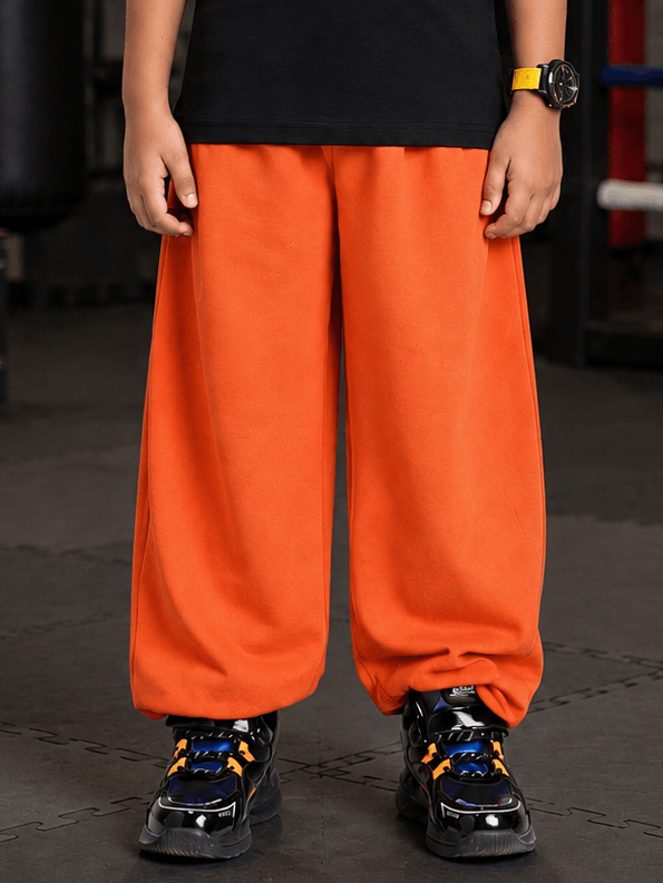COOLFIT JOGGER FOR BOYS GIRLS ORANGE styled for active kids, showcasing vibrant orange color and relaxed fit.