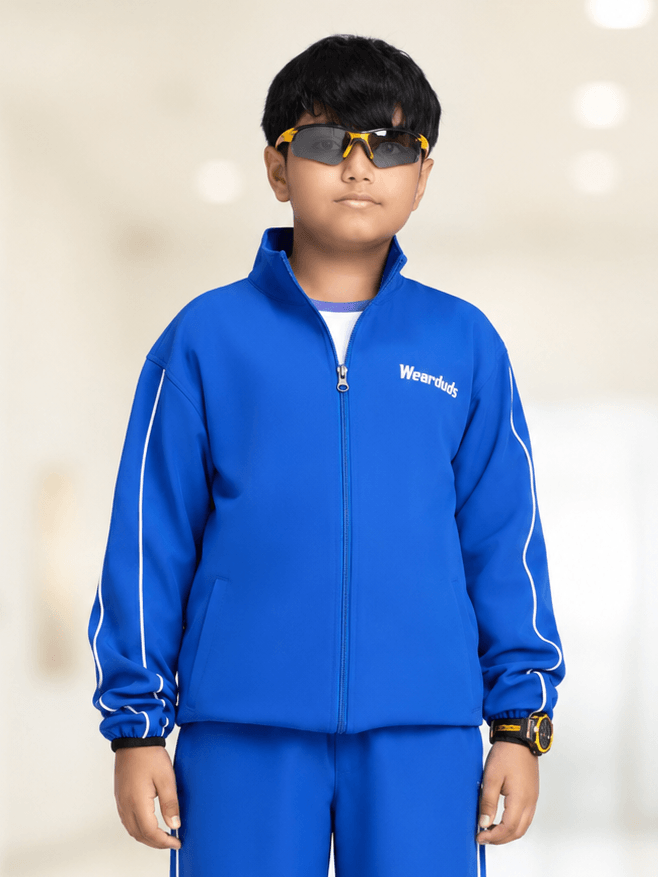 RELIGHT RELAXED FIT JACKET FOR BOYS GIRLS ROYAL BLUE worn by a boy with sunglasses.