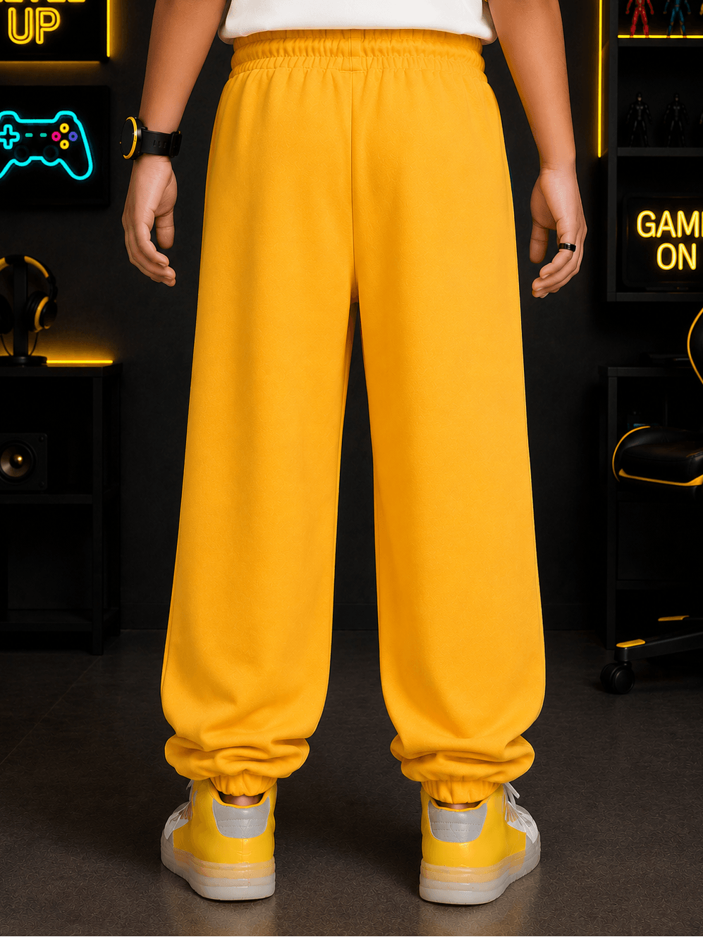 EMOJI VIBES JOGGER FOR BOYS GIRLS YELLOW shown from the back, highlighting its vibrant yellow color and relaxed fit.
