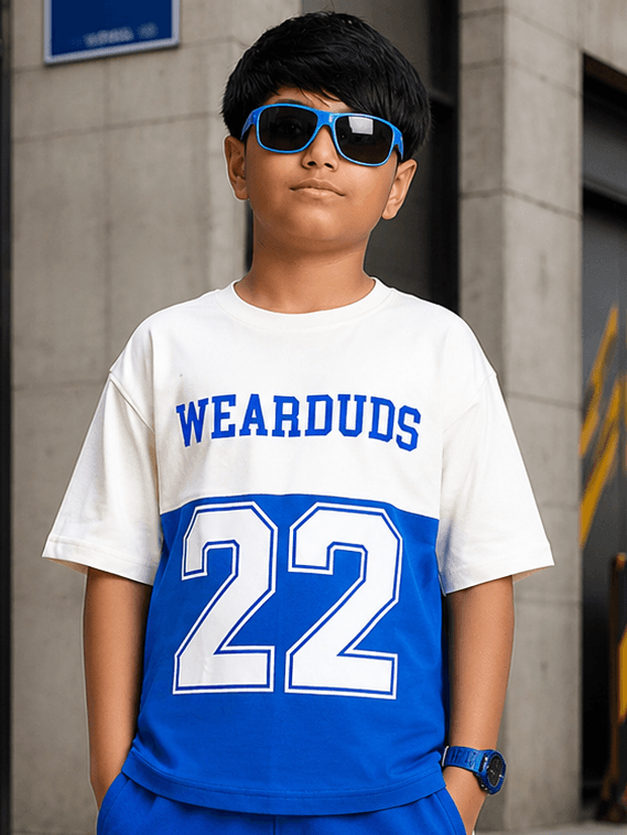 ELECTRIC FLEX T-SHIRT FOR BOYS GIRLS WHITE BLUE worn by a boy with sunglasses in a stylish urban setting.