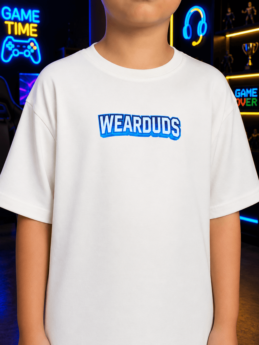 FUSION T-SHIRT FOR BOYS GIRLS WHITE worn by a child in a gaming room setting.
