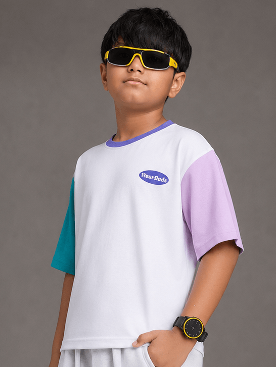 CHILL T-SHIRT FOR BOYS GIRLS WHITE MULTI showcased on a boy wearing sunglasses and a trendy white multi-colour t-shirt.