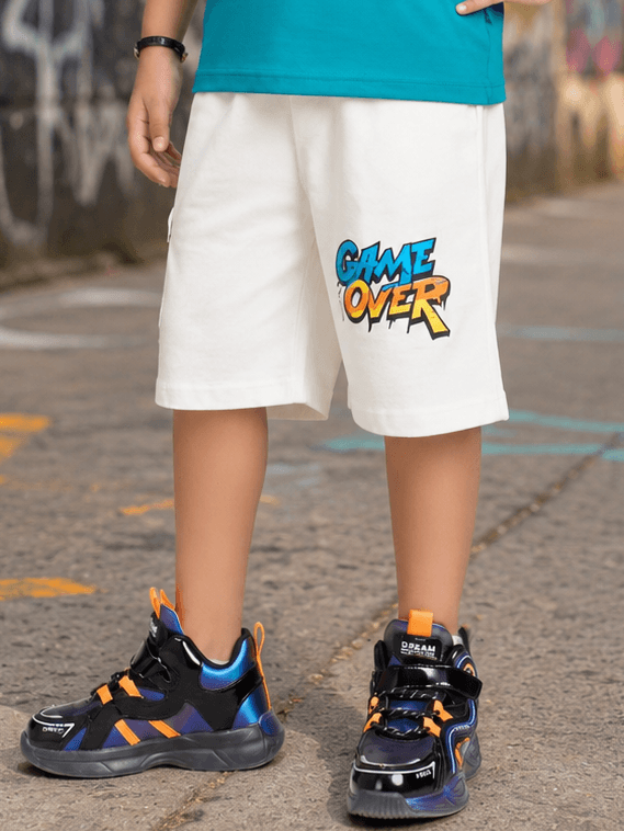 JUNIOR SHORTS FOR BOYS GIRLS WHITE featuring a colorful 'GAME OVER' print, perfect for active kids.