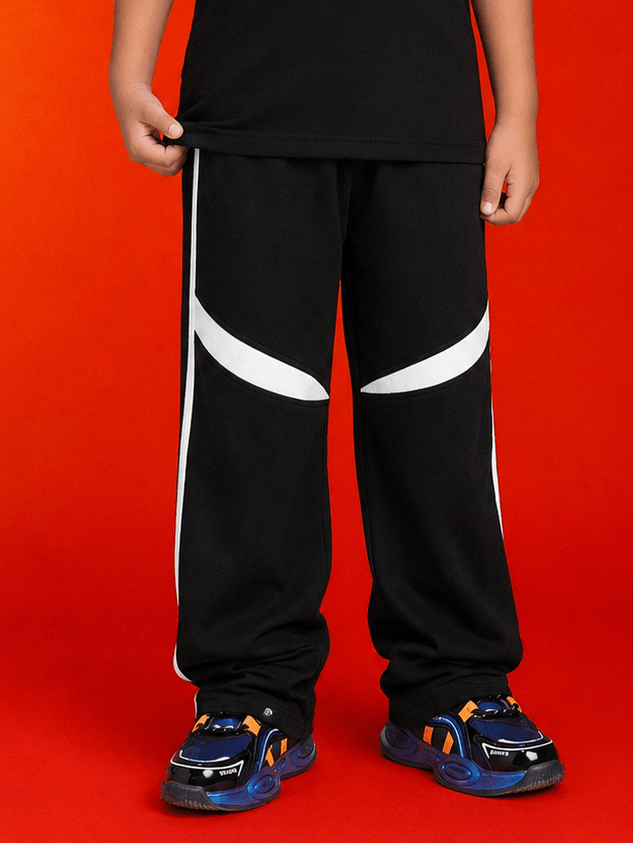 KIDS ROSTER JOGGER FOR BOYS GIRLS BLACK WHITE worn by a child, featuring a stylish black design with white accents.