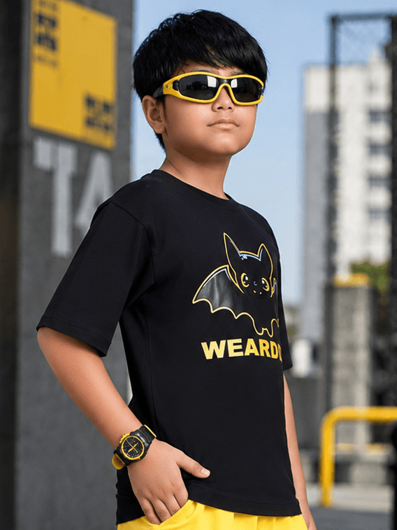 MIDNIGHT BAT T-SHIRT FOR BOYS GIRLS BLACK worn by a boy wearing sunglasses in an urban setting.