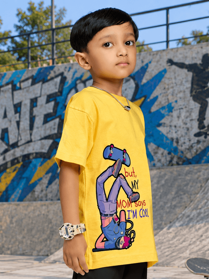 COOL DUDE SKATER T-SHIRT FOR BOYS GIRLS YELLOW worn by a kid at a skate park, showcasing vibrant design and streetwear vibe.