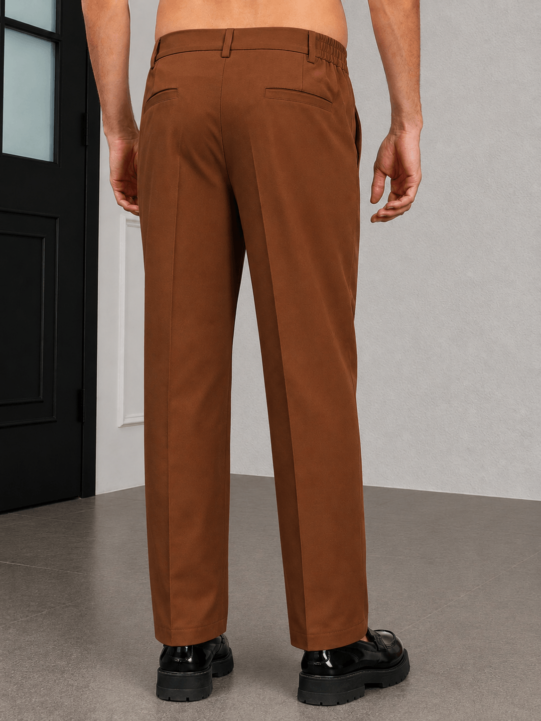 HIGH-FLEX TAILORED PANTS BROWN showcasing a stylish back view in rich brown, designed for comfort and sophistication.