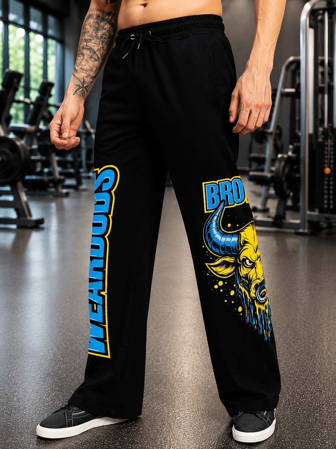 BULL RELAXED-FIT WIDE LEG JOGGER BLACK featuring bold graphics in a gym setting.
