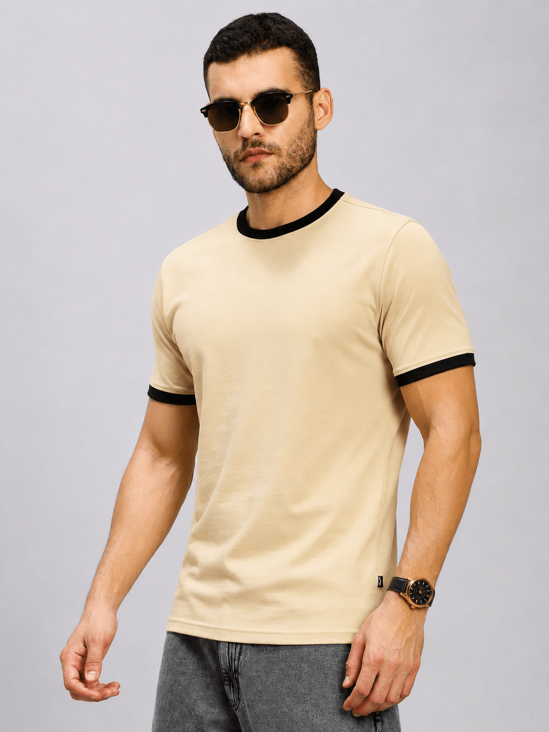 MINIMALIST CONTRAST EDGE T-SHIRT BEIGE worn by a model, featuring beige fabric and contrast edge detailing.
