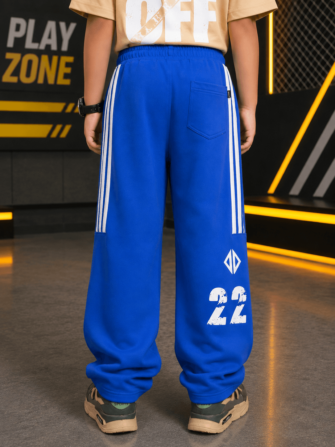 NEO STREET DROP JOGGER FOR BOYS GIRLS BLUE back view, featuring a vibrant blue color with sporty white stripes and number 22.