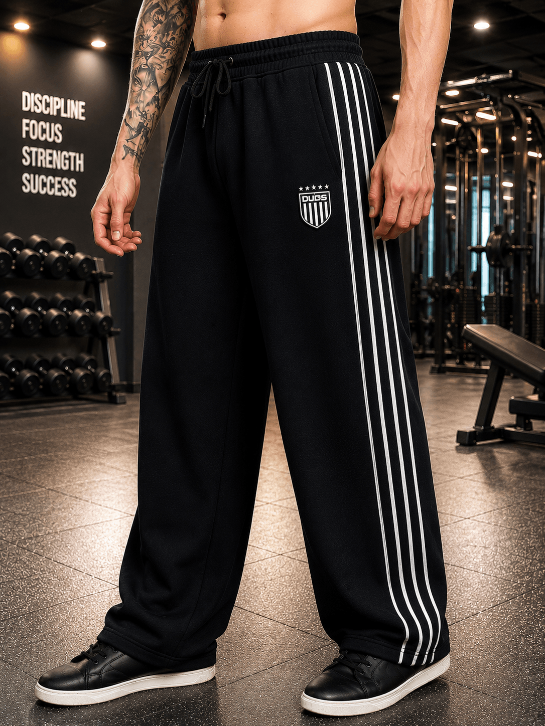 BLACK OUT-FIT JOGGERS BLACK on a person in a gym setting, featuring a stylish design and a comfortable fit.