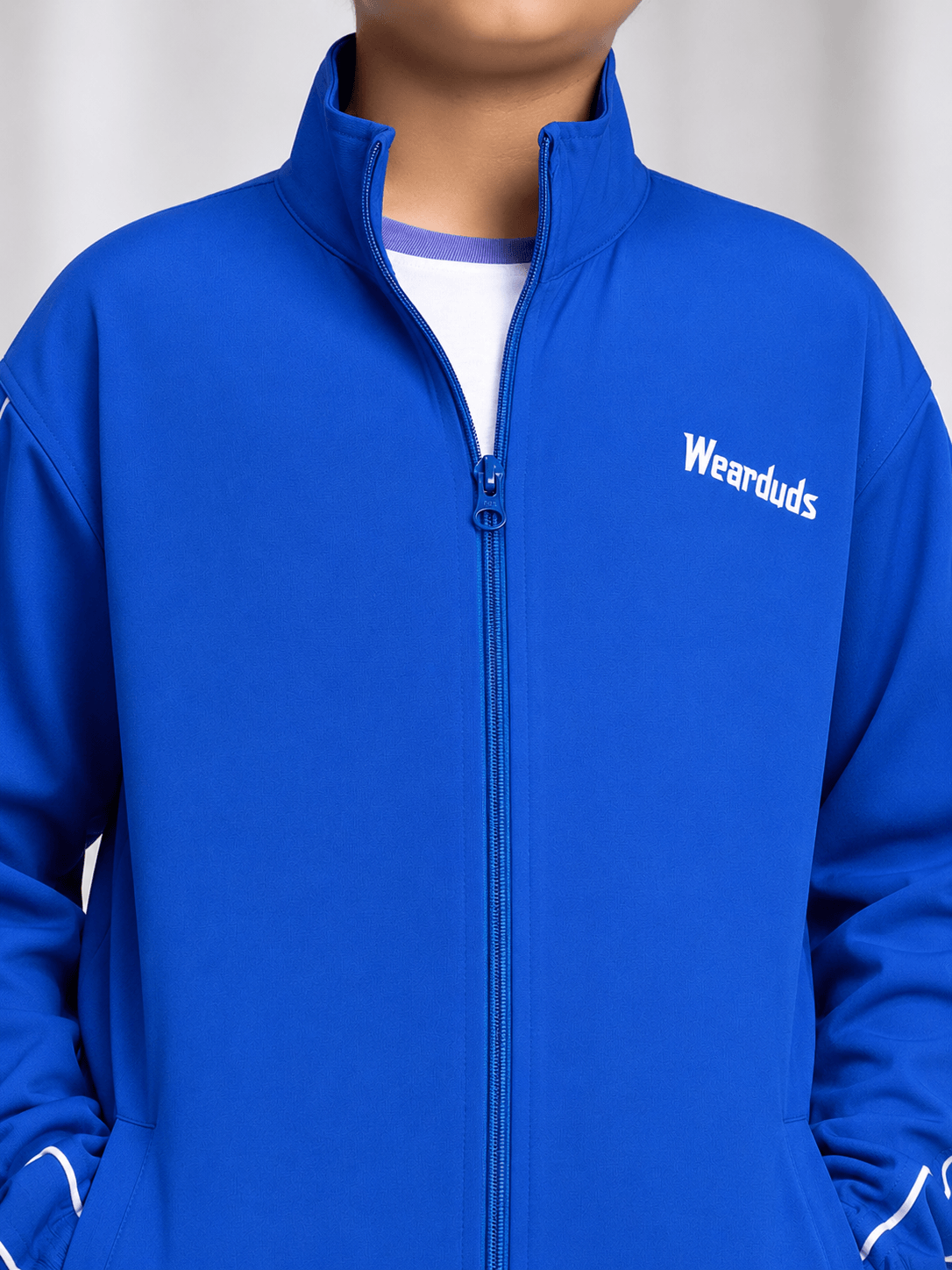 RELIGHT RELAXED FIT JACKET FOR BOYS GIRLS ROYAL BLUE worn by child, showcasing vibrant color and comfortable fit.