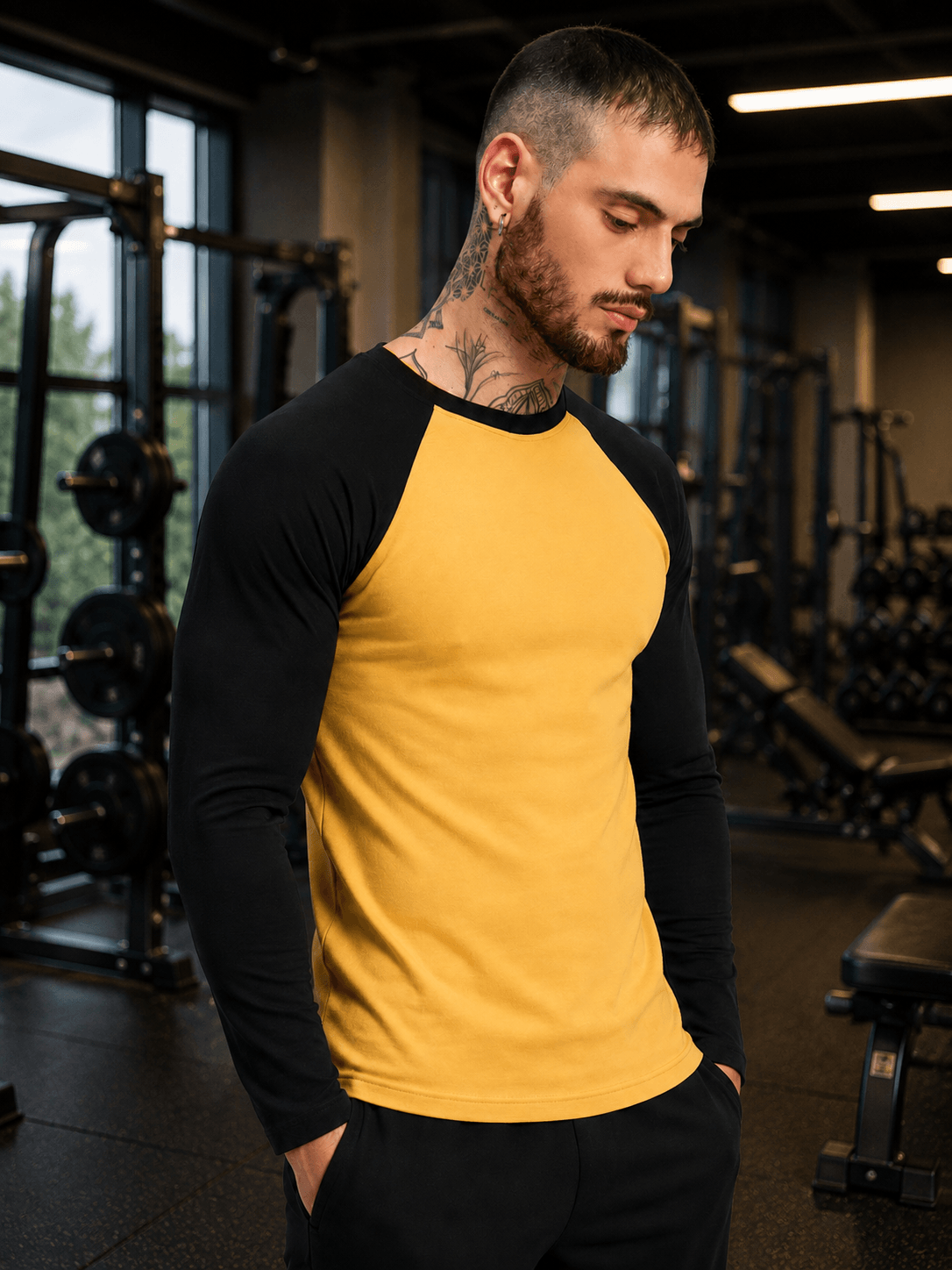 FITFLOW SLIM FIT SWEATSHIRT YELLOW BLACK worn by a model in a gym setting, showcasing athletic style.