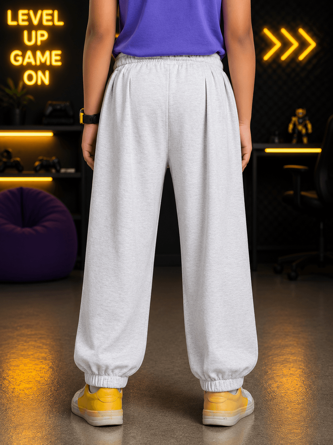 COOLFIT JOGGER FOR BOYS GIRLS WHITE showcasing the back view of gray joggers worn by a child.