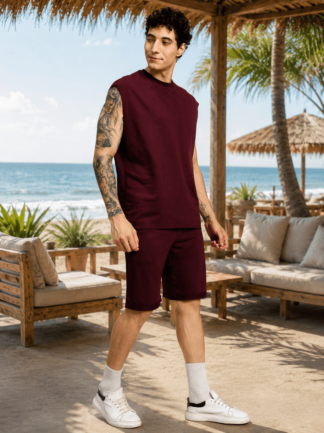 Man wearing DRIVE MONOCHROME CO-ORD SET MAROON by the beach, showcasing a stylish and comfortable streetwear look.