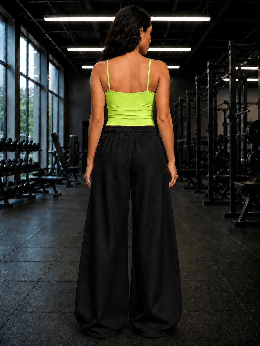 Women Seamless Cotton Crop-Top Neon Green worn by model from the back in a gym setting with black pants.