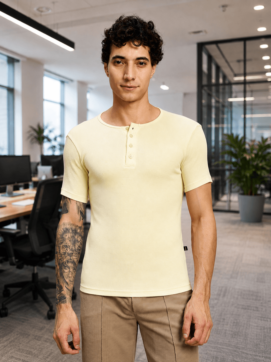SPEARMINT VECTOR T-SHIRT CREAM YELLOW worn by a model in a modern office setting.