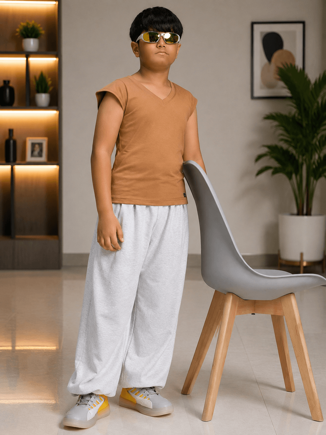 LEVELUP GAMER T-SHIRT FOR BOYS GIRLS BROWN worn by a boy in sunglasses, paired with grey pants and stylish sneakers.