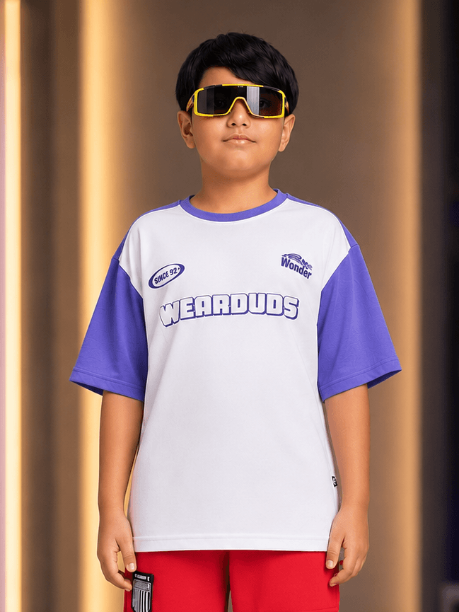 STREET WONDER T-SHIRT FOR BOYS GIRLS WHITE worn by a boy in stylish sunglasses and colorful shorts.