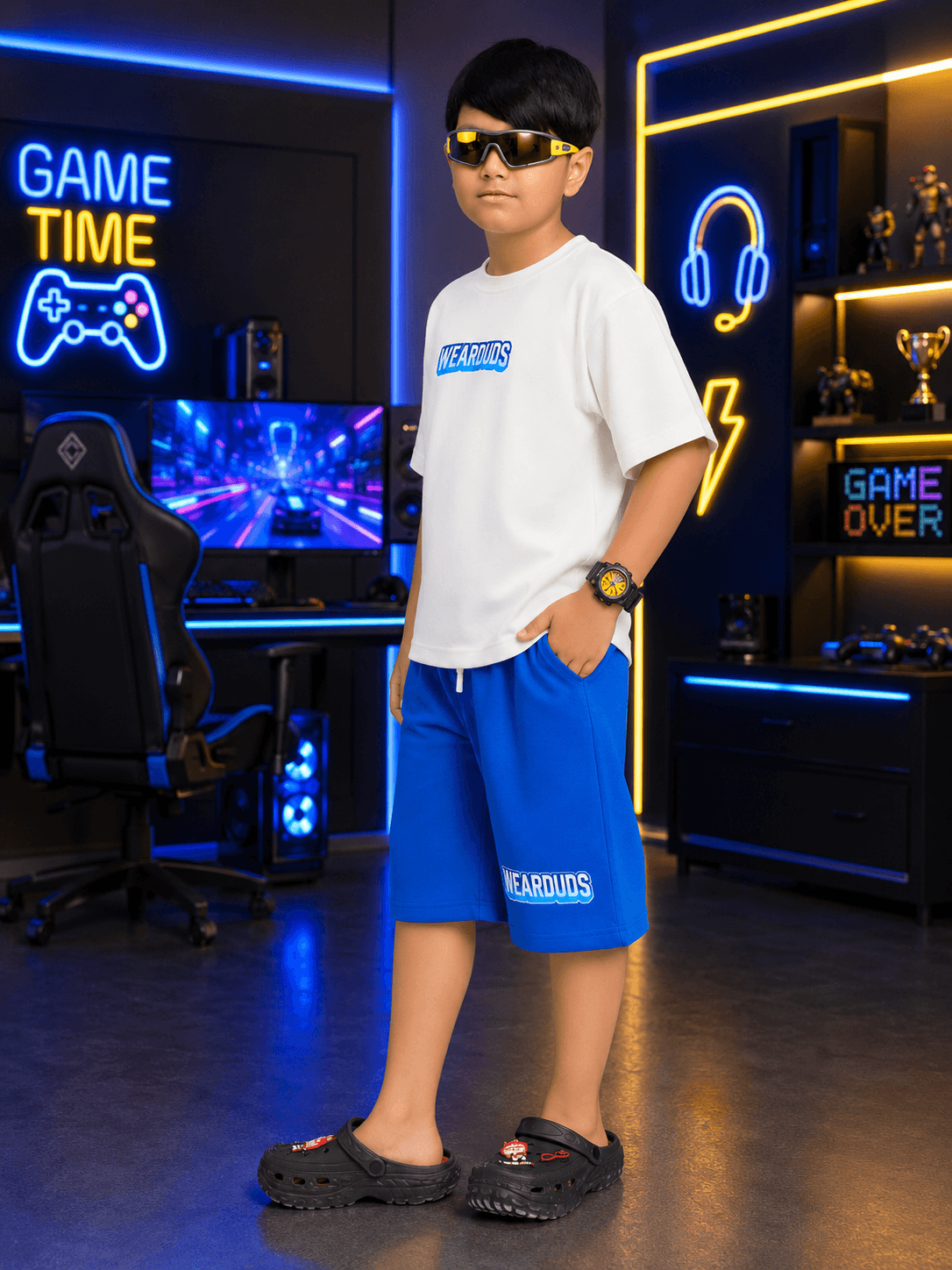 FUSION CO-ORD FOR BOYS GIRLS WHITE BLUE worn by a boy in a gaming setup with stylish sunglasses.