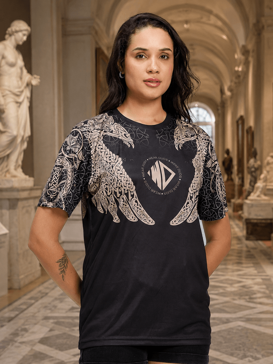 Women Aura of Asgard Regular T-Shirt Black displayed on model in an art gallery setting, showcasing mythical design.