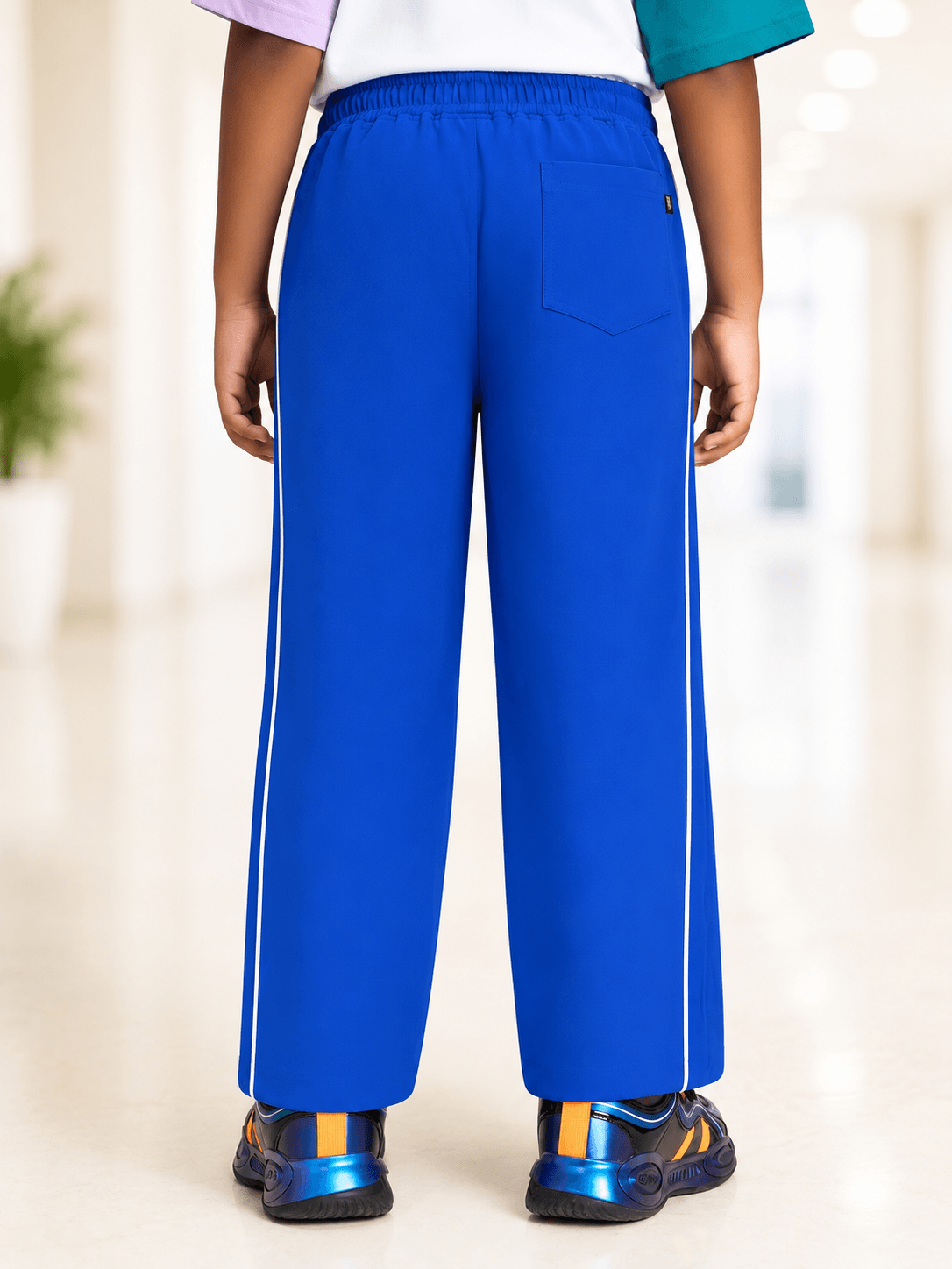Back view of RELIGHT RELAXED FIT JOGGER FOR BOYS GIRLS ROYAL BLUE, showcasing its vibrant color and stylish design.